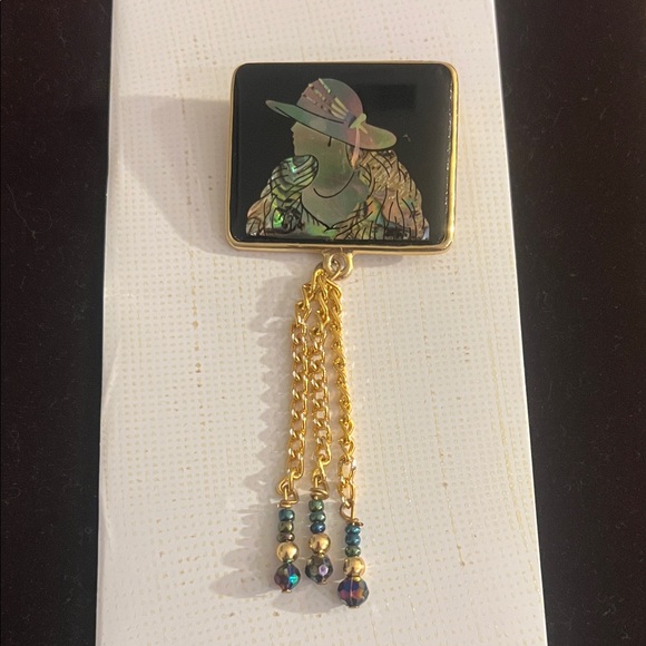 Jewelry - Elegant Black and Gold Brooch with Chain Tassels